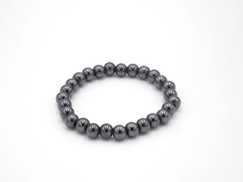 Pulsera de hematite 8mm con cuentas pulidas y acabado brillante sobre fondo neutro