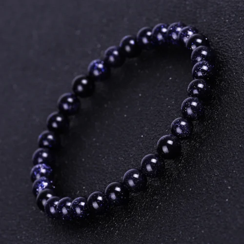 Pulsera aventurina azul 6 mm de mineral natural sobre superficie neutra